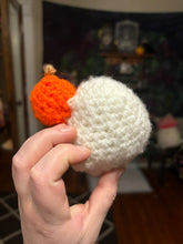 Load image into Gallery viewer, Little Crochet Ghost holding a pumpkin
