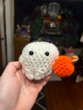 Load image into Gallery viewer, Little Crochet Ghost holding a pumpkin
