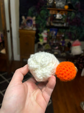 Load image into Gallery viewer, Little Crochet Ghost holding a pumpkin
